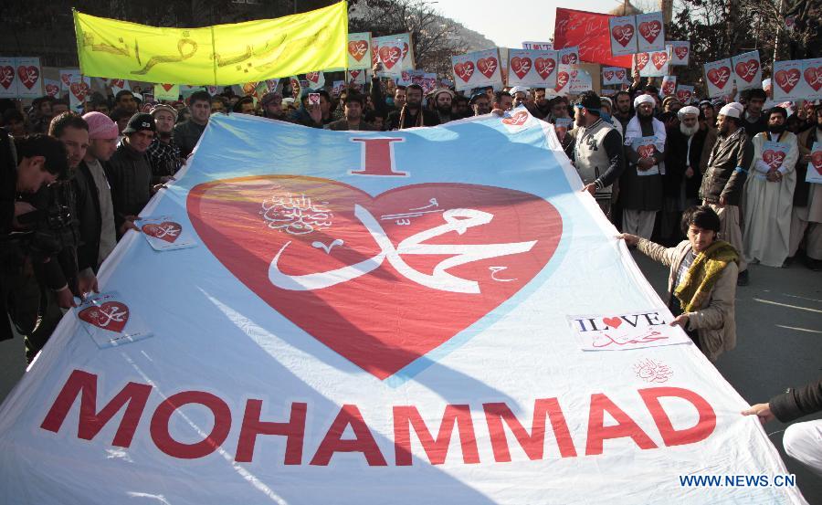 Afghan people holding placards attend a protest against caricatures published in French magazine Charlie Hebdo in Kabul, Afghanistan, Jan. 24, 2015. 