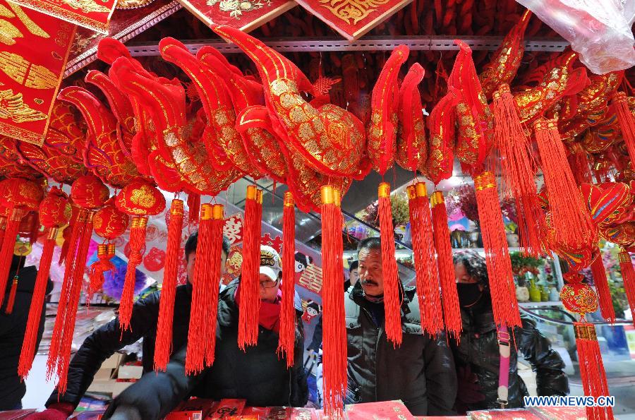 People select ornaments at a shopping mall in Yinchuan, capital of northwest China's Ningxia Hui Autonomous Region, Feb. 2, 2015.