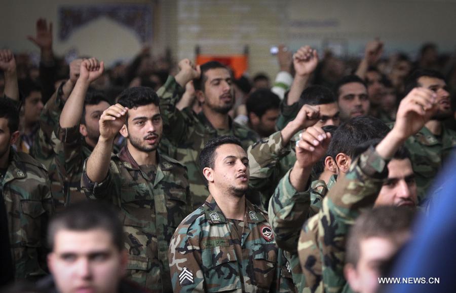 Iranians attend a ceremony marking the 36th anniversary of the return from exile of the founder of Iran's Islamic Republic, Ayatollah Ruhollah Khomeini on Feb. 1, 2015 at Khomeini's mausoleum in a suburb of Tehran.