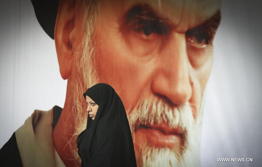 Iranians attend a ceremony marking the 36th anniversary of the return from exile of the founder of Iran's Islamic Republic, Ayatollah Ruhollah Khomeini on Feb. 1, 2015 at Khomeini's mausoleum in a suburb of Tehran.