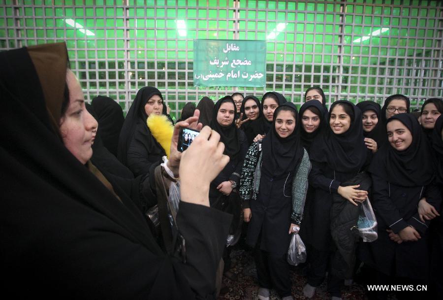 Iranians attend a ceremony marking the 36th anniversary of the return from exile of the founder of Iran's Islamic Republic, Ayatollah Ruhollah Khomeini on Feb. 1, 2015 at Khomeini's mausoleum in a suburb of Tehran.