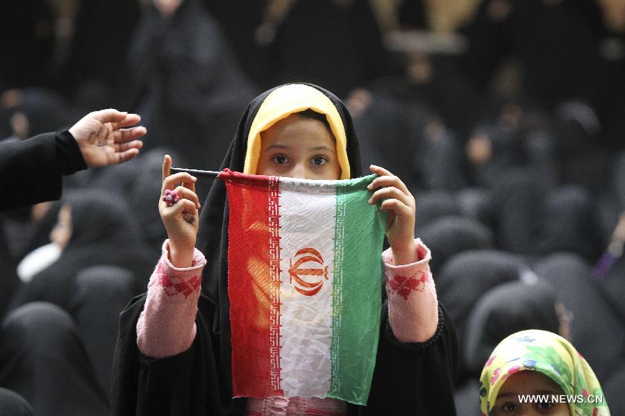 Iranians attend a ceremony marking the 36th anniversary of the return from exile of the founder of Iran's Islamic Republic, Ayatollah Ruhollah Khomeini on Feb. 1, 2015 at Khomeini's mausoleum in a suburb of Tehran.