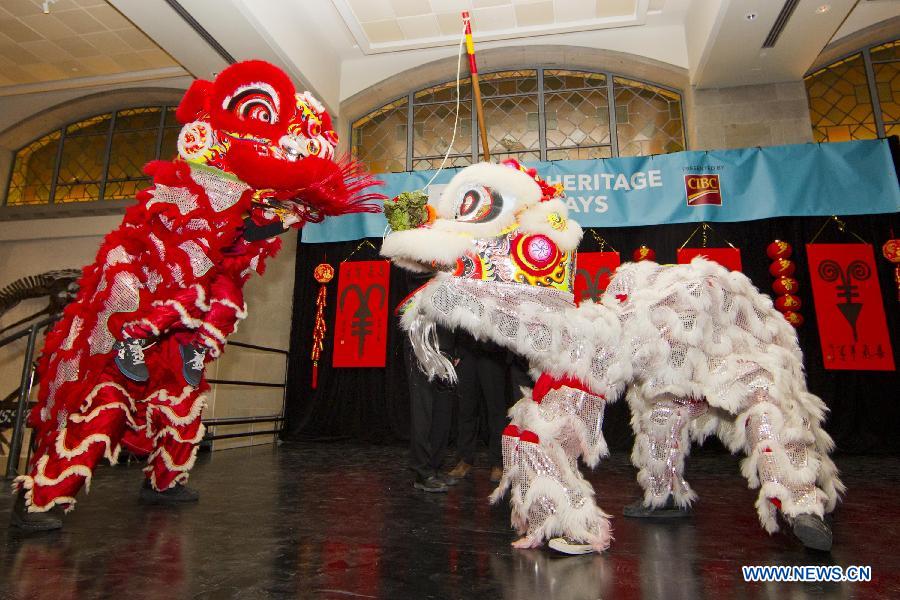 The lion dance team performs during the 2015 Chinese New Year Extravaganza at the Royal Ontario Museum in Toronto, Canada, Feb. 14, 2015.