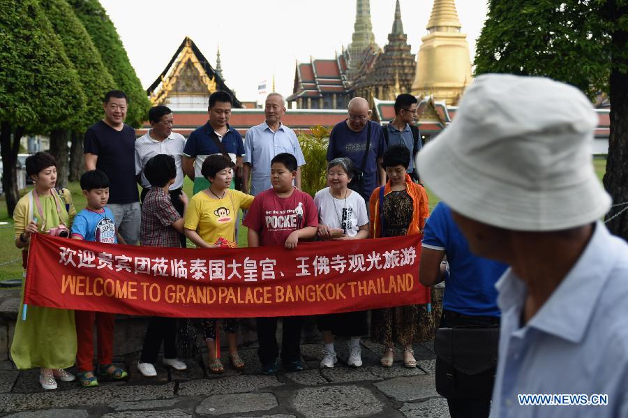 Some Chinese tourists visit the Grand Palace in Bangkok, capital of Thailand, on Feb. 15, 2015.