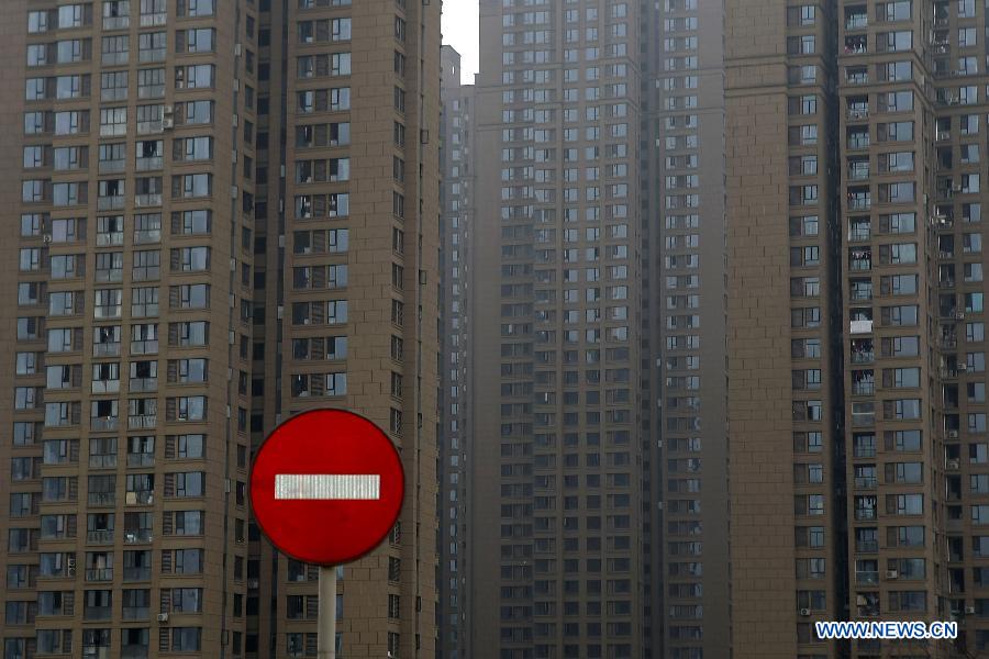 Photo taken on Feb. 17, 2015 shows residential apartment buildings in Chongqing, southwest China. China's real estate market has continued a downward trend with new home prices in January registering month-on-month declines in most of surveyed cities. Of 70 large and medium-sized cities surveyed, 64 saw new home prices drop in January from the previous month, according to data released on Tuesday by the National Bureau of Statistics (NBS). Meanwhile, new home prices were flat in Shanghai, Nanjing, Nanchang and Guangzhou last month, while Shenzhen and Ganzhou saw prices rise 0.3 percent and 0.2 percent respectively from December, the NBS data showed.