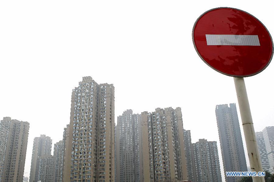 Photo taken on Feb. 17, 2015 shows residential apartment buildings in Chongqing, southwest China. China's real estate market has continued a downward trend with new home prices in January registering month-on-month declines in most of surveyed cities. Of 70 large and medium-sized cities surveyed, 64 saw new home prices drop in January from the previous month, according to data released on Tuesday by the National Bureau of Statistics (NBS). Meanwhile, new home prices were flat in Shanghai, Nanjing, Nanchang and Guangzhou last month, while Shenzhen and Ganzhou saw prices rise 0.3 percent and 0.2 percent respectively from December, the NBS data showed.