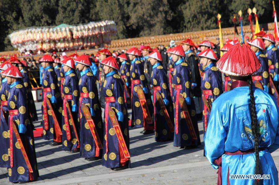 Actors perform a royal rite worshiping the god of earth by Qing Dynasty emperors at the opening of the annual temple fair at Ditan Park, also known as the Temple of Earth, Feb. 18, 2015.