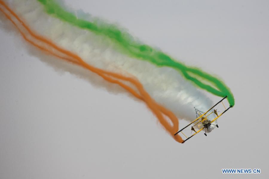 Catwalk or Skycats of the Scandinavian Aerobatic Team leave a trail of Indian tri-colour smoke as they perform aerobatics on the second day of the Aero India 2015 in Air Force Station Yelahanka of Bengaluru, Karnataka of India, Feb. 19, 2015. The biennial air show this year attracted dealers from 49 countries such as US, Russia, France, Israel, UK and so on.