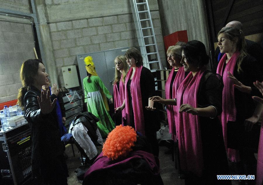 Performers prepare before the Chinese Spring Festival soiree, organized by Chinese students in Brussels, Belgium, Feb. 25, 2015.