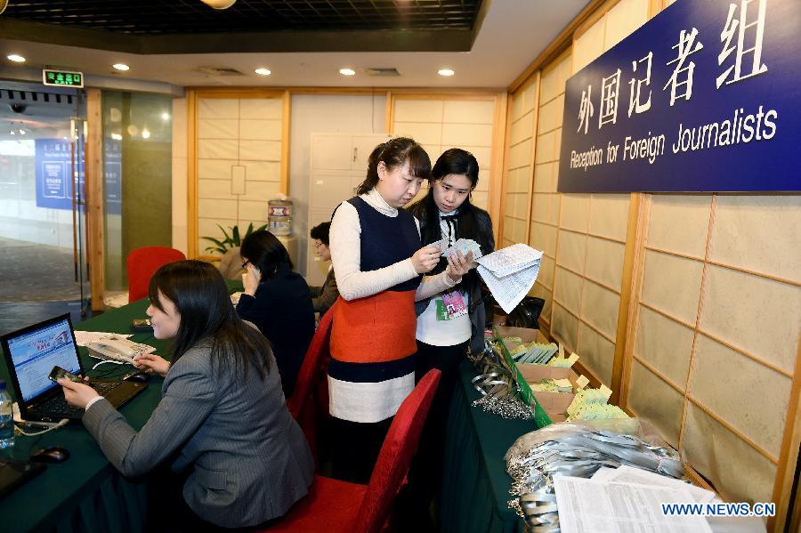 Staff members work at the Reception for Foreign Journalists in Beijing, China, March 1, 2015. 