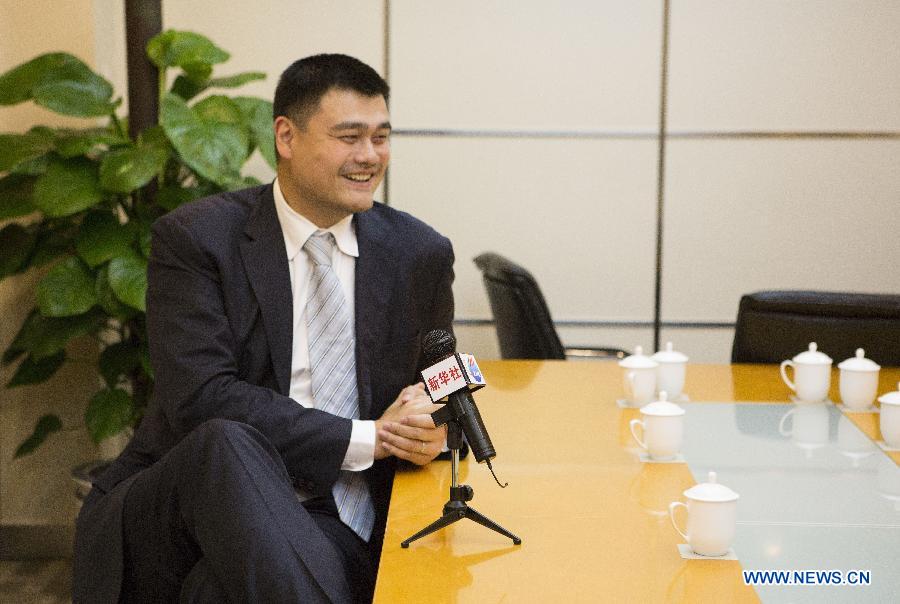 Yao Ming, former NBA star and a member of the 12th National Committee of the Chinese People's Political Consultative Conference (CPPCC), receives an exclusive interview with Xinhua News Agency and answers questions concerning his proposal on promoting physical education of specific sports in Beijing, capital of China, March 3, 2015.