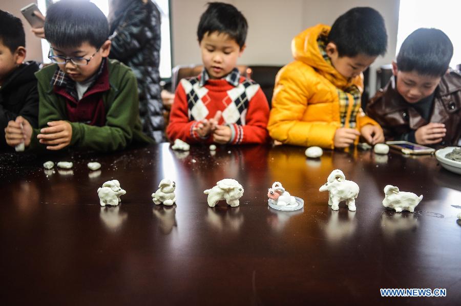 Children mould goats with flour during an activity to celebrate the coming Lantern Festival in Hangzhou, capital of east China's Zhejiang Province, March 4, 2015. The Lantern Festival falls on March 5 this year. (Xinhua/Xu Yu) 