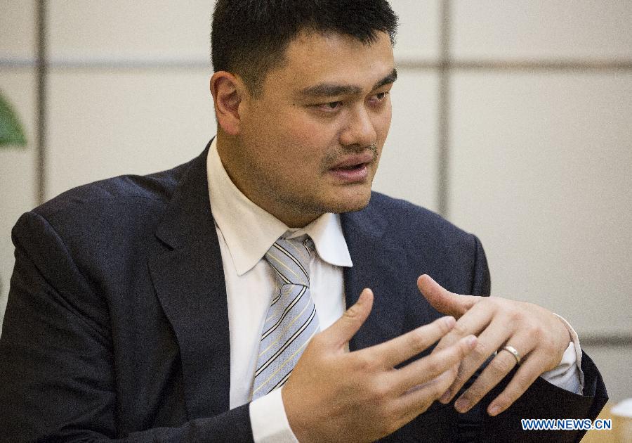 Yao Ming, former NBA star and a member of the 12th National Committee of the Chinese People's Political Consultative Conference (CPPCC), receives an exclusive interview with Xinhua News Agency and answers questions concerning his proposal on promoting physical education of specific sports in Beijing, capital of China, March 3, 2015.