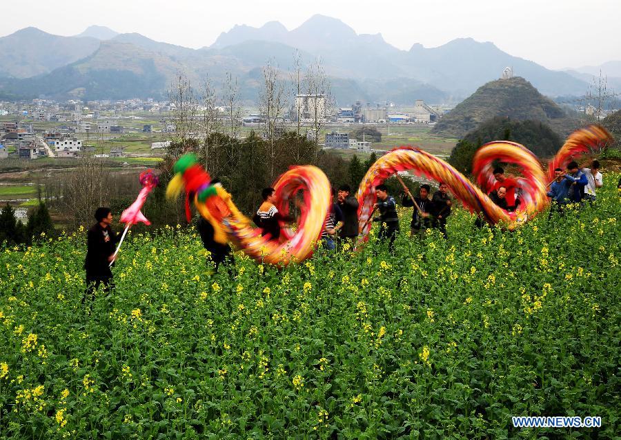 Villagers perform a dragon dance to celebrate the coming Lantern Festival in the Zhaiying Ancient Town of Songtao Miao Autonomous Region, southwest China's Guizhou Province, March 3, 2015. The Lantern Festival falls on March 5 this year. (Xinhua/Wu Weidong) 