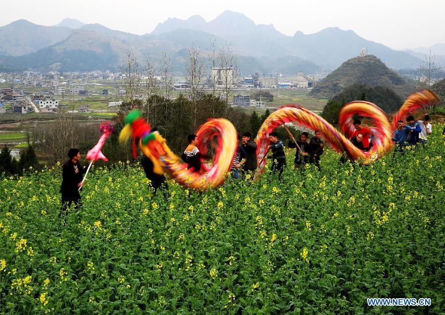 Villagers perform a dragon dance to celebrate the coming Lantern Festival in the Zhaiying Ancient Town of Songtao Miao Autonomous Region, southwest China's Guizhou Province, March 3, 2015. The Lantern Festival falls on March 5 this year. (Xinhua/Wu Weidong) 