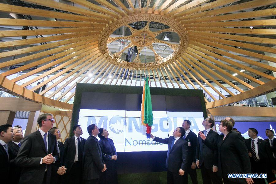 Mongolian President Tsakhiagiin Elbegdorjm (C) attends the launching ceremony at the stand of Mongolia, this year's partner country, during the Berlin International Tourism Fair (ITB), in Berlin, Germany, on March 4, 2015.