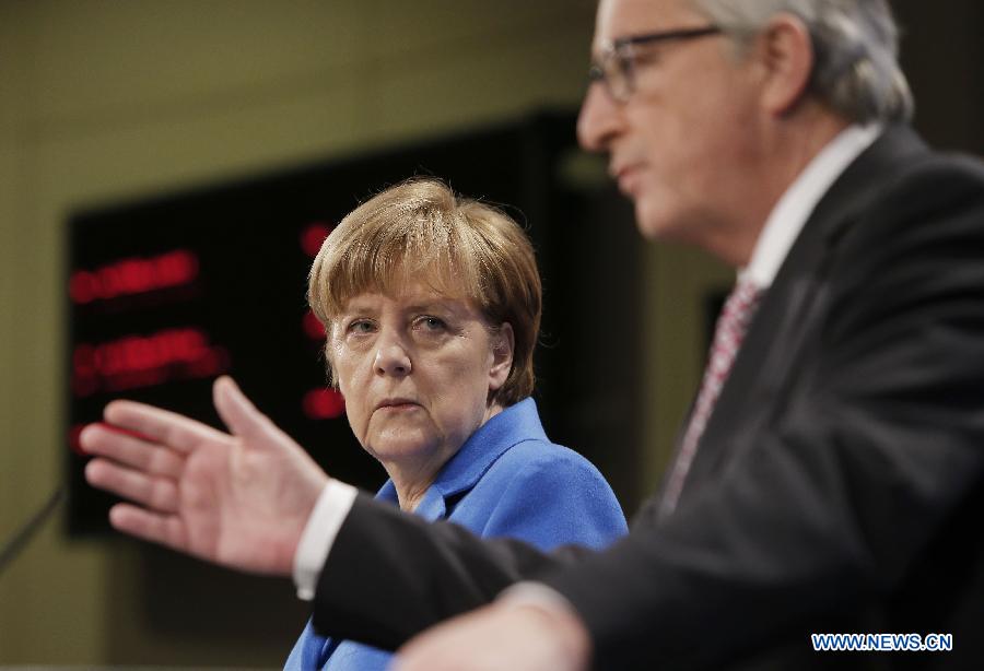 German Chancellor Angela Merkel (L) and European Commission President Jean-Claude Juncker attend a press conference in Brussels, Belgium, on March 4, 2015. 