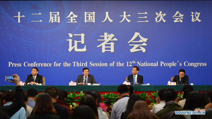 Chinese finance minister Lou Jiwei (2nd L, back) and vice finance minister Liu Kun (2nd R, back) give a press conference for the third session of China's 12th National People's Congress (NPC) on fiscal and tax reform, in Beijing, capital of China, March 6, 2015. (Xinhua/LiXiang)