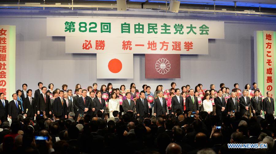 Attendees pose during the annual convention of the Liberal Democratic Party (LDP), in Tokyo, Japan, March 8, 2015.