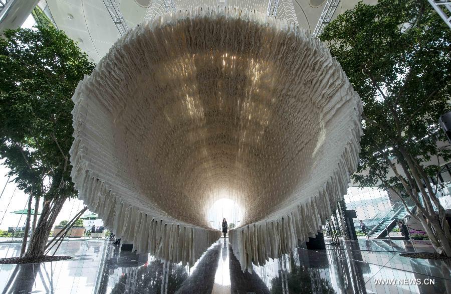 The 18-meter-long artwork is made of bamboo, cotton threads and over 12,000 pieces of Chinese art paper.