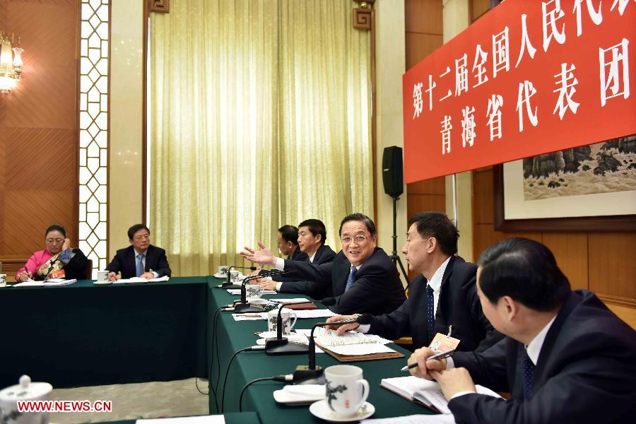 Yu Zhengsheng (3rd R), chairman of the National Committee of the Chinese People's Political Consultative Conference (CPPCC) and a member of the Standing Committee of the Political Bureau of the Communist Party of China (CPC) Central Committee, joins a discussion with deputies to the 12th National People's Congress (NPC) from northwest China's Qinghai Province during the third session of the 12th NPC, in Beijing, capital of China, March 8, 2015. 