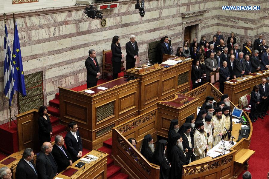 Newly elected Greek President Prokopis Pavlopoulos waits to take the oath during a swearing-in ceremony inside the parliament in Athens, Greek, on March 13, 2015. 