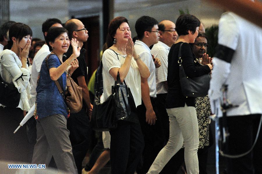 Singapore's founding Prime Minister Lee Kuan Yew's casket was transferred Wednesday from Sri Temasek, the prime minister's official residence on the Istana grounds, to Parliament House where his body will lie in state until Saturday.