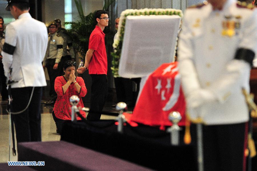 Singapore's founding Prime Minister Lee Kuan Yew's casket was transferred Wednesday from Sri Temasek, the prime minister's official residence on the Istana grounds, to Parliament House where his body will lie in state until Saturday.