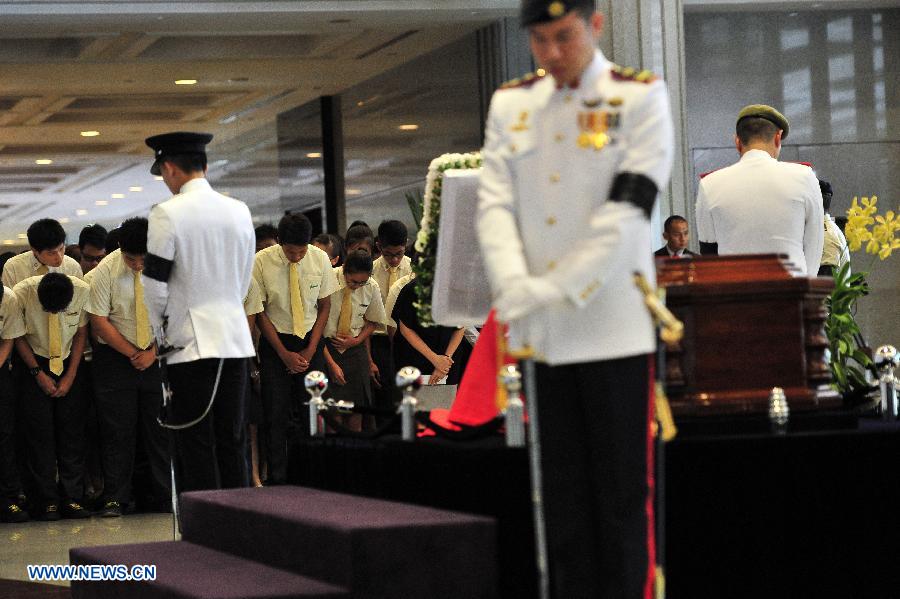 Singapore's founding Prime Minister Lee Kuan Yew's casket was transferred Wednesday from Sri Temasek, the prime minister's official residence on the Istana grounds, to Parliament House where his body will lie in state until Saturday.