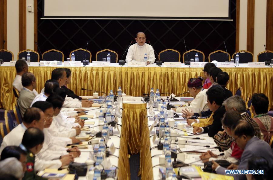 Myanmar President U Thein Sein (C) delivers a speech during a signing ceremony of draft of the Nationwide Cease-fire Agreement (NCA) between Members of Myanmar government's Union Peace-Making Work Committee (UPWC) and the ethnic armed groups' National Ceasefire Coordination Team (NCCT) at the Myanmar Peace Center in Yangon, Myanmar, March 31, 2015.