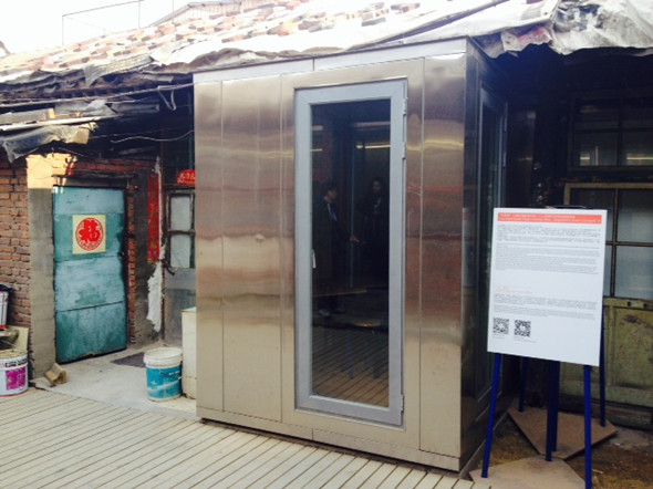 The box is inserted into existing structure, instead of rebuilding or renovating the delicate house. (Photo/Ecns.cn)