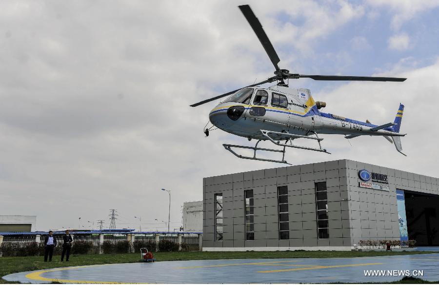 A helicopter flies in a demonstration flight at a helicopter store in Ningbo, east China's Zhejiang Province, April 8, 2015. The helicopter store was open on Wednesday. (Xinhua) 