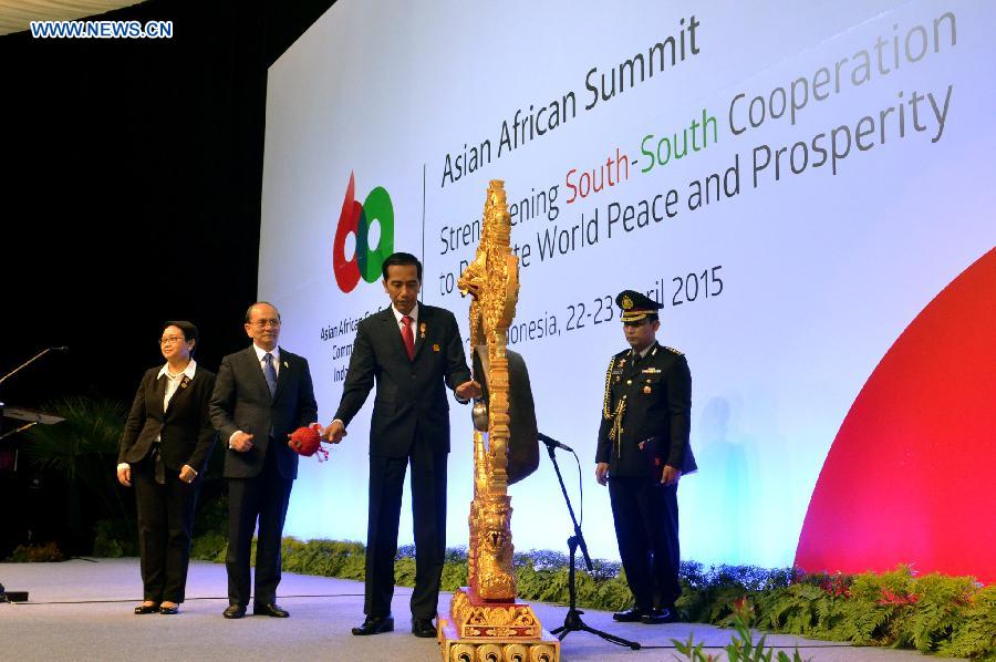 Indonesian President Joko Widodo (2nd, R) beats a gong marking the opening of Asian African Summit 2015 in Jakarta, Indonesia, on April 22, 2015.