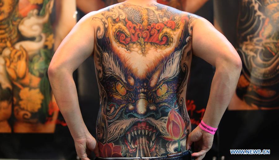 A man shows his tattoo during the 5th International Nepal Tattoo Convention in Kathmandu, Nepal, April 24, 2015. 