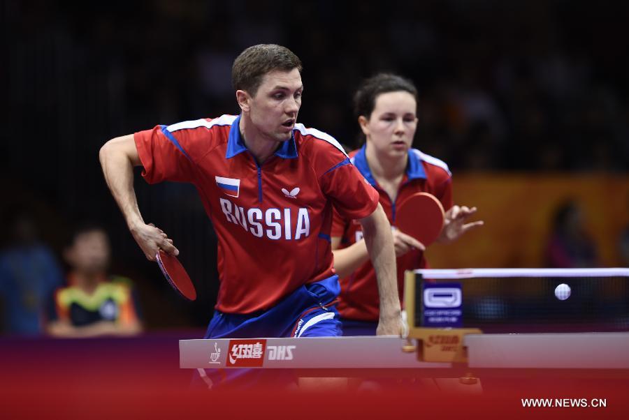 Russia's Alexey Liventsov/Yulia Prokhorova (L) compete during the Mixed Doubles match against China's Xu Xin/South Korea's Yang Haeun at the 53rd Table Tennis World Championships in Suzhou, city of east China's Jiangsu Province, on April 29, 2015. Xu Xin/Yang Haeun won the match 4-2. (Xinhua/Li Ga) 