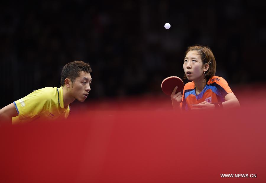 China's Xu Xin/South Korea's Yang Haeun (R) competes against Russia's Alexey Liventsov/Yulia Prokhorova during the Mixed Doubles match at the 53rd Table Tennis World Championships in Suzhou, city of east China's Jiangsu Province, on April 29, 2015. Xu Xin/South Korea's Yang Haeun won the match 4-2. (Xinhua/Li Ga) 