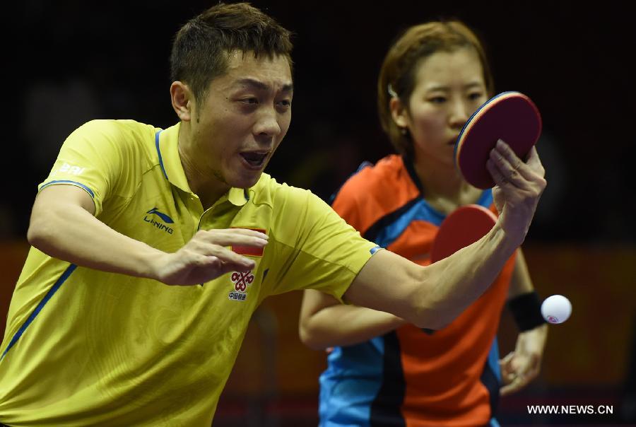 China's Xu Xin(L)/South Korea's Yang Haeun compete during the Mixed Doubles match against Russia's Alexey Liventsov/Yulia Prokhorova at the 53rd Table Tennis World Championships in Suzhou, city of east China's Jiangsu Province, on April 29, 2015. Xu Xin/Yang Haeun won the match 4-2. (Xinhua/Han Yuqing) 