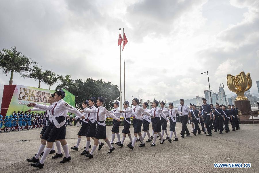 Young people attend a national flag-raising ceremony in Hong Kong, south China, May 4, 2015, to celebrate the Chinese Youth Day marking the May 4th Movement that happened on May 4, 1919, ushering in the new-democratic revolution in China. (Xinhua/Lui Siu Wai)
