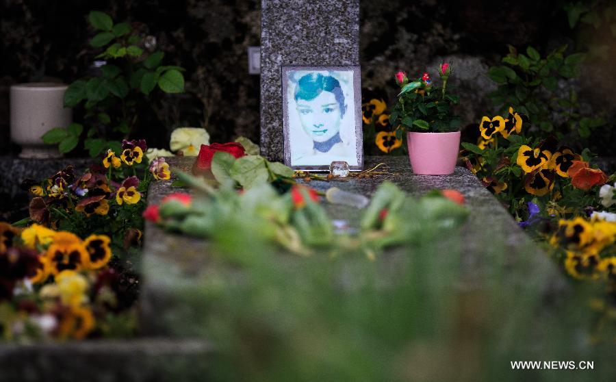 Flowers are placed at the grave of actress Audrey Hepburn in Tolochenaz village in Switzerland, May 4, 2015.