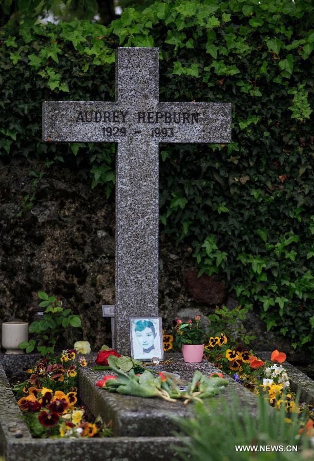 Flowers are placed at the grave of actress Audrey Hepburn in Tolochenaz village in Switzerland, May 4, 2015.