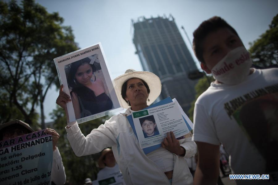 Residents take part in a protest in Mexico City, capital of Mexico, on May 10, 2015. 