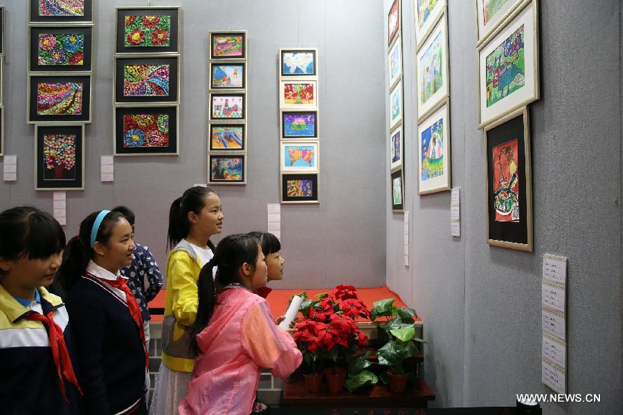 The ten-day painting and calligraphy exhibition, displaying more than 300 works created by primary school students, opened in Beijing Tuesday. 