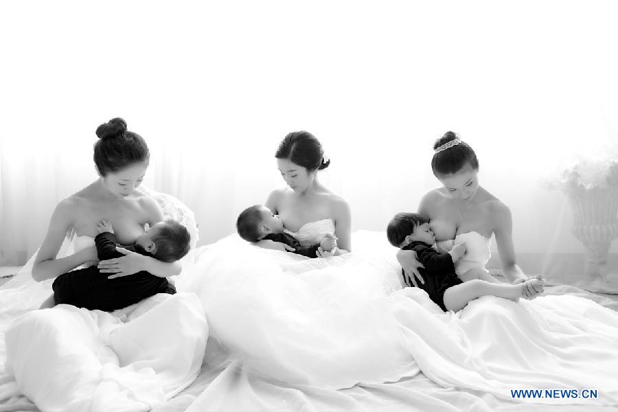 Photo provided by La Leche League-China shows mothers breastfeeding their children. May 20 is China's National Breastfeeding Awareness Day. As the pronounciation of '520' is close to 'I Love You,' many mothers feel meaningful to have their breastfeeding photos to make public. La Leche League-China, a branch of an international organization that provides mother-to-mother support, information and encouragment for breastfeeding, has collected art photos of breastfeeding mothers for three consecutive years. (Xinhua/La Leche League-China)  