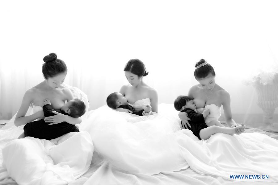 Photo provided by La Leche League-China shows mothers breastfeeding their children. May 20 is China's National Breastfeeding Awareness Day. As the pronounciation of '520' is close to 'I Love You,' many mothers feel meaningful to have their breastfeeding photos to make public. La Leche League-China, a branch of an international organization that provides mother-to-mother support, information and encouragment for breastfeeding, has collected art photos of breastfeeding mothers for three consecutive years. (Xinhua/La Leche League-China)  