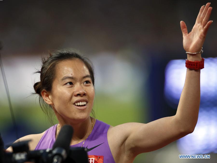 Wu Shuijiao of China celebrates after Women's 100m Hurdles Final of 2015 IAAF World Challenge at National Stadium (Birds Nest) in Beijing, China on May 20, 2015.