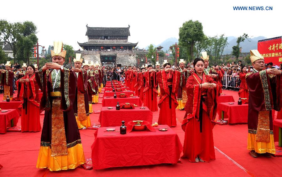 A total of 24 couples attended the wedding ceremony which followed the nuptial rites of Han Dynasty (220 B.C.-220 A.D.) on Sunday.