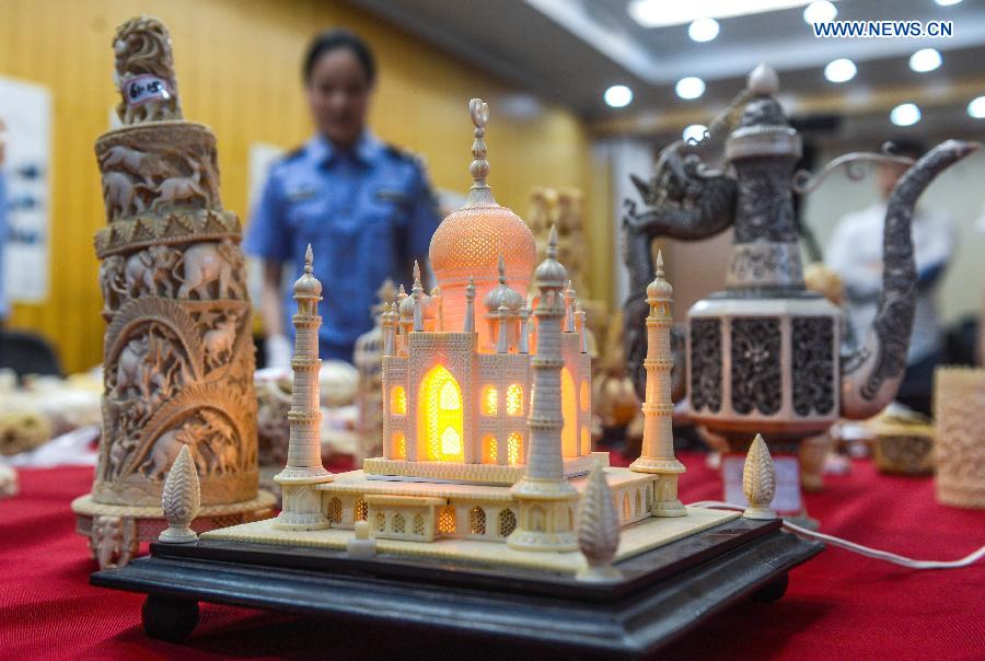 Photo taken on May 18, 2015 shows smuggled artworks made of ivory seized by members of Hangzhou Customs, in Hangzhou, east China's Zhejiang Province. Hangzhou Customs announced Thursday that they have seized over 270 kilograms smuggled ivory and about 9 kilograms rhino horn since June last year.