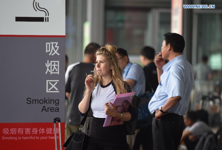 A new smoking ban took effect in Beijing on June 1. The new ban, the country's toughest to date, prohibits smoking in all the city's indoor public places, workplaces, and on public transportation. Following the ban, the capital's airport on Monday closed three smoking rooms in its three terminals and opened 11 smoking spaces outside.