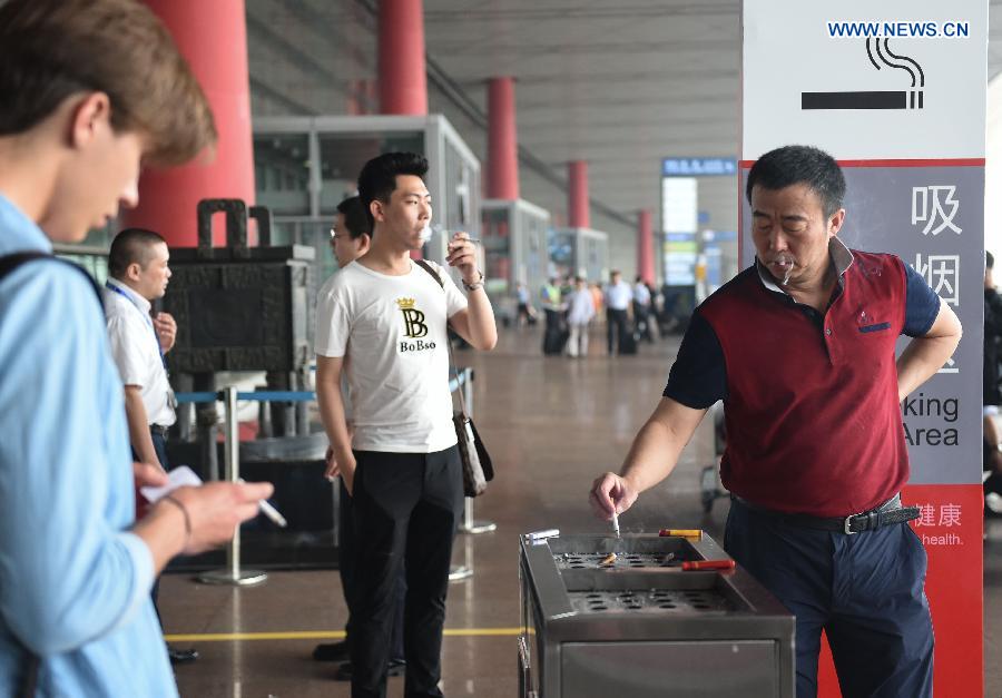 A new smoking ban took effect in Beijing on June 1. The new ban, the country's toughest to date, prohibits smoking in all the city's indoor public places, workplaces, and on public transportation. Following the ban, the capital's airport on Monday closed three smoking rooms in its three terminals and opened 11 smoking spaces outside.