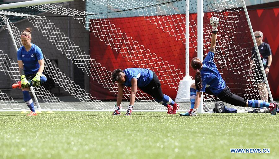 Canada's goalkeepers Erin McLeod, Karina LeBlanc and Stephanie Labbe attend a training session in the Commonwealth Stadium one day ahead of the opening match with China at the 2015 FIFA Women's World Cup in Edmonton, Canada, June 5, 2015.